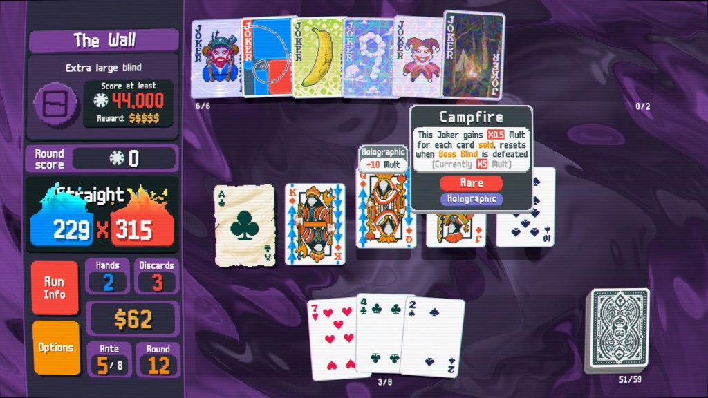 A straight in Balatro, consisting of an ace of clubs, a king, queen, and jack of diamonds, and 10 of spades. The campfire is among several jokers, currently multipying the total score by 5. "The Wall" blind requires a score of at least 44,000 to win - and the current score number is 229 x 315, wreathed in blue and red flames respectively.