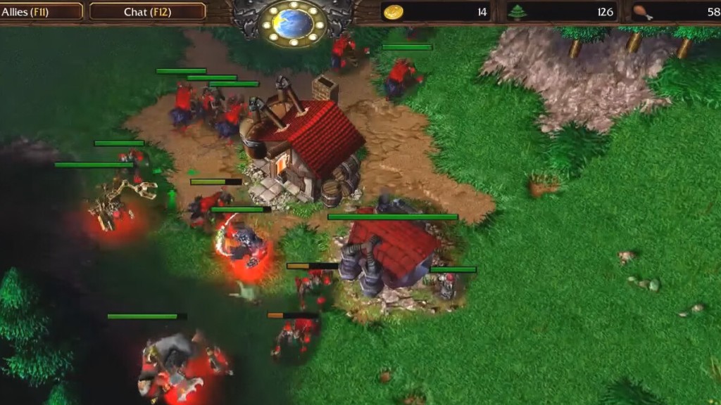 Screenshot of Warcraft 3, showing red-roofed buildings on a green field. 